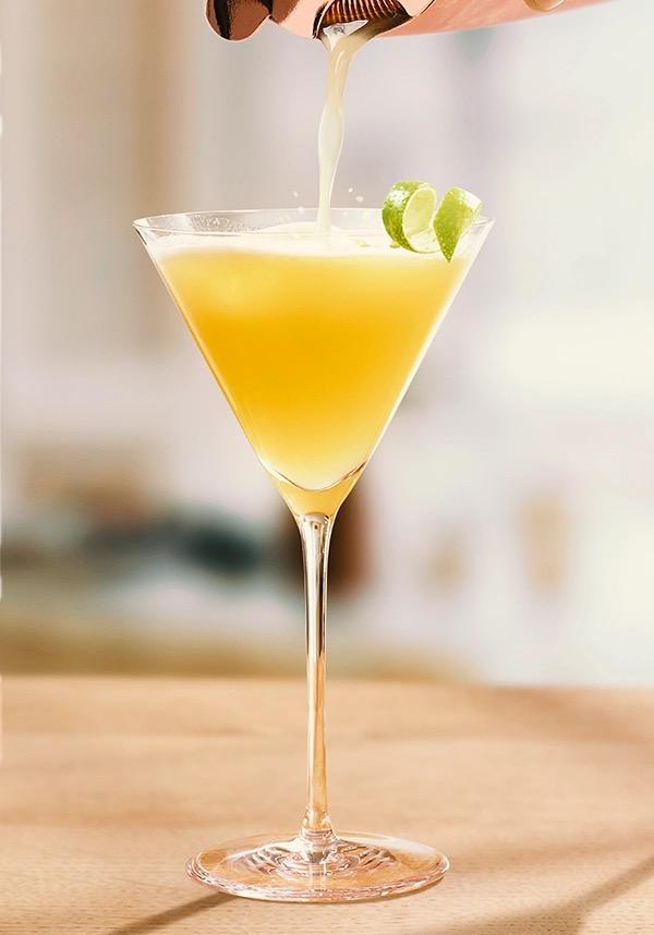 Ketel One Vodka Gimlet in Coupe Glass with hand pouring serve