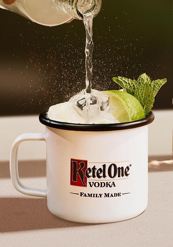 Ketel One Ketel One Mule in Enamel Mug with hand adding tonic