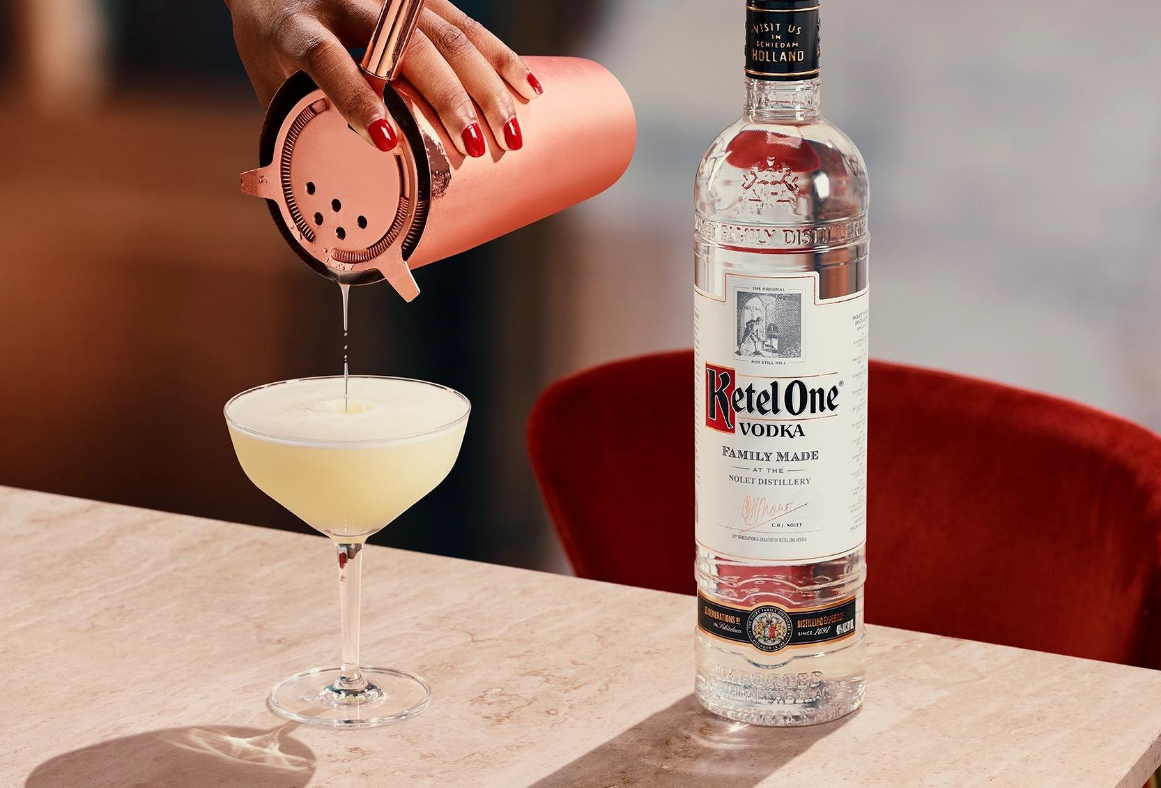 Ketel One Vodka Sour in Coupe Glass with hand pouring serve