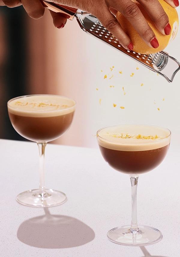 Ketel One Espresso Martini in Coupe Glass with hand grating orange 
